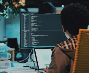 boy in front of computer monitor